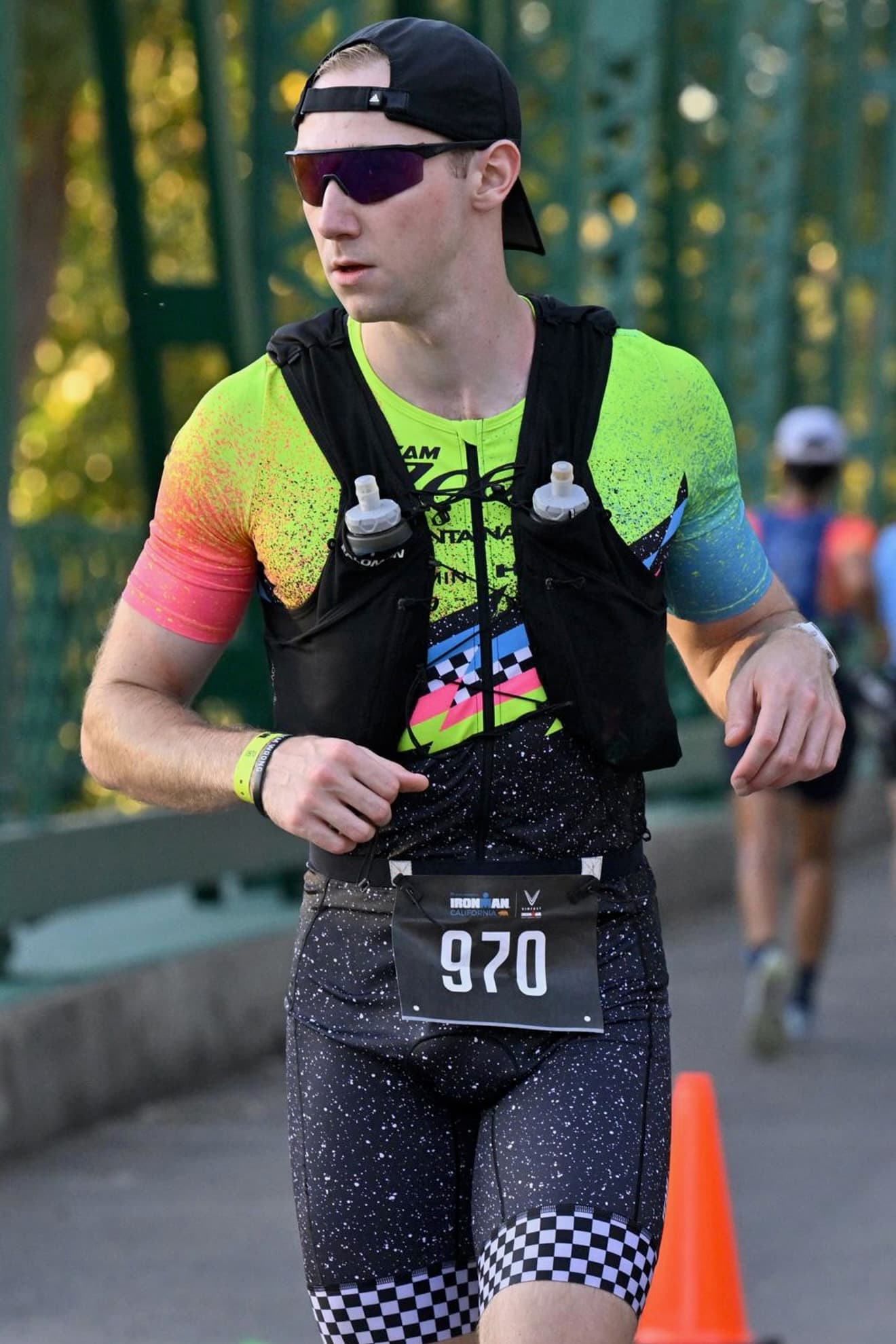 Alex, founder of Aeros Training, racing the run leg of a triathlon